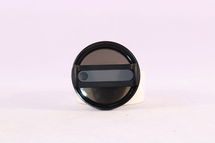 a black round object with a black handle