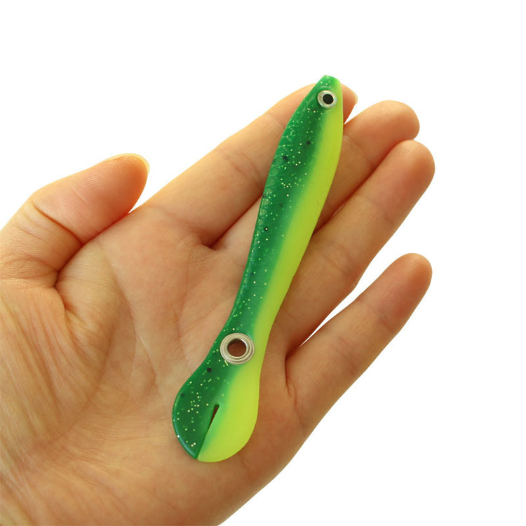 a hand holding a fishing lure