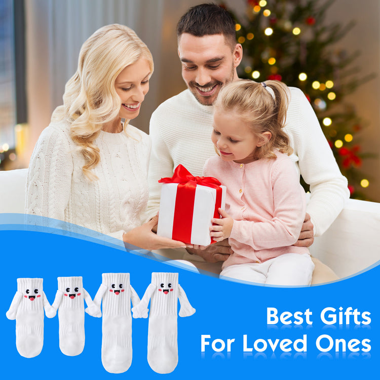 a man woman and a child holding a gift box