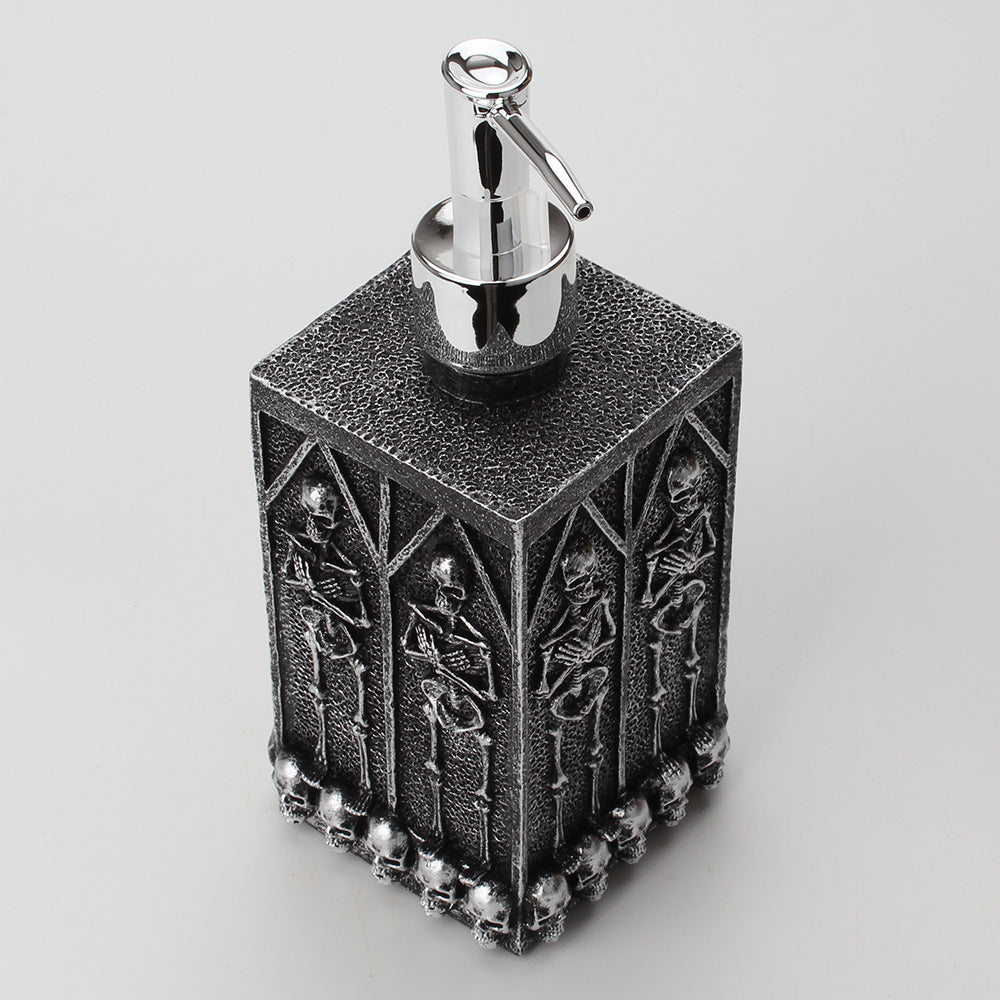 a black and silver soap dispenser