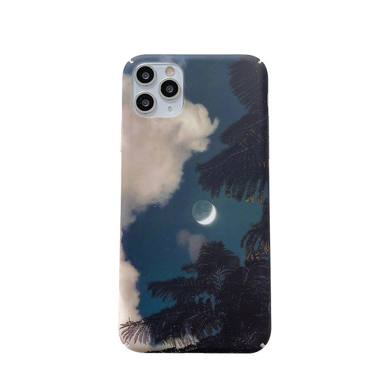 a phone case with a moon and trees