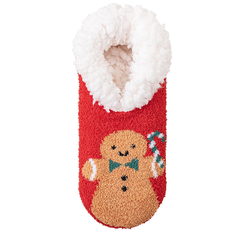a red and white sock with a gingerbread man and candy cane