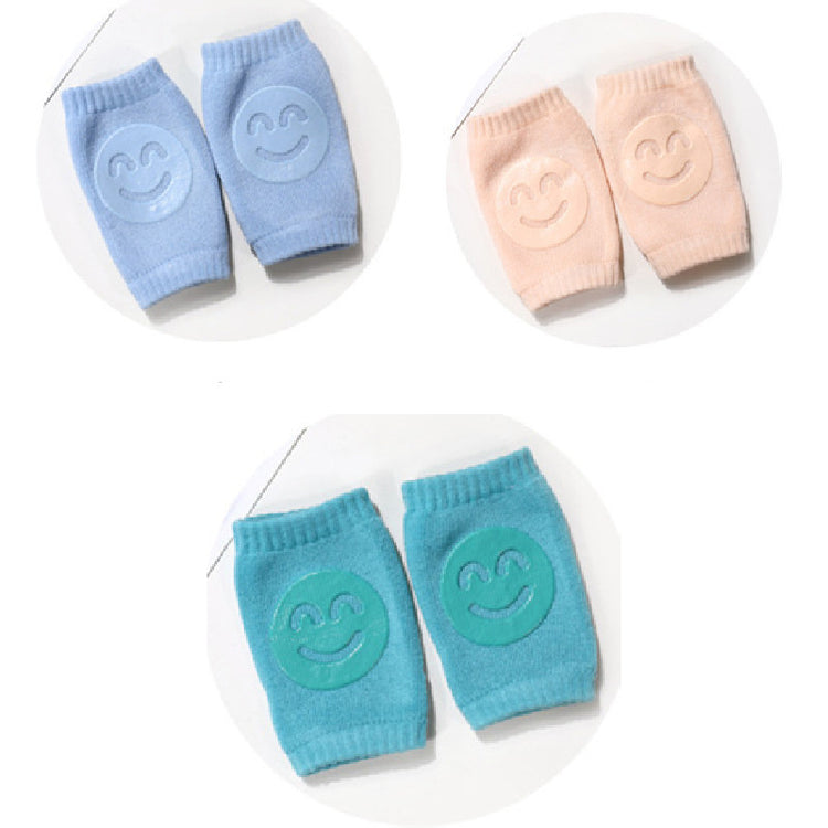 a pair of baby socks with smiley faces