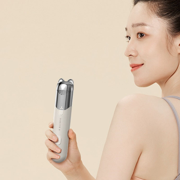 a woman holding a device
