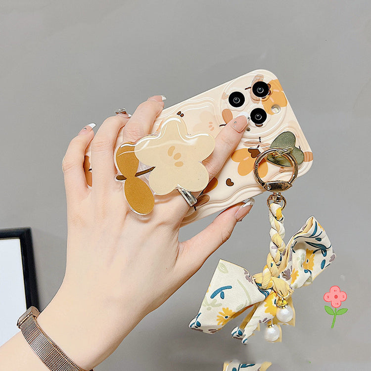 a hand holding a phone case
