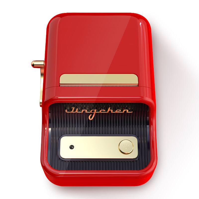 a red pencil sharpener with a gold and black cover
