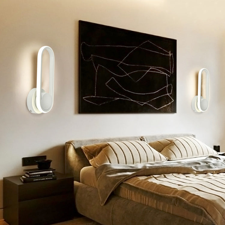 a bed with a bed frame and a painting on the wall