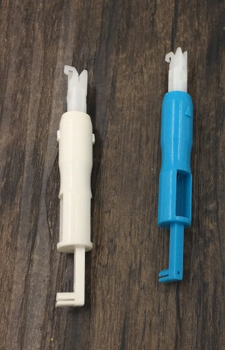 a group of blue and white needles