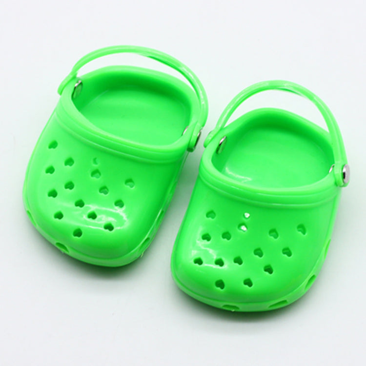 a pair of green plastic shoes