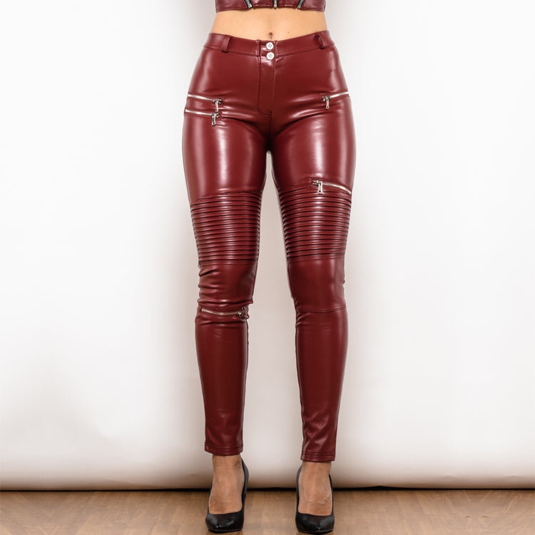 a woman wearing red leather pants