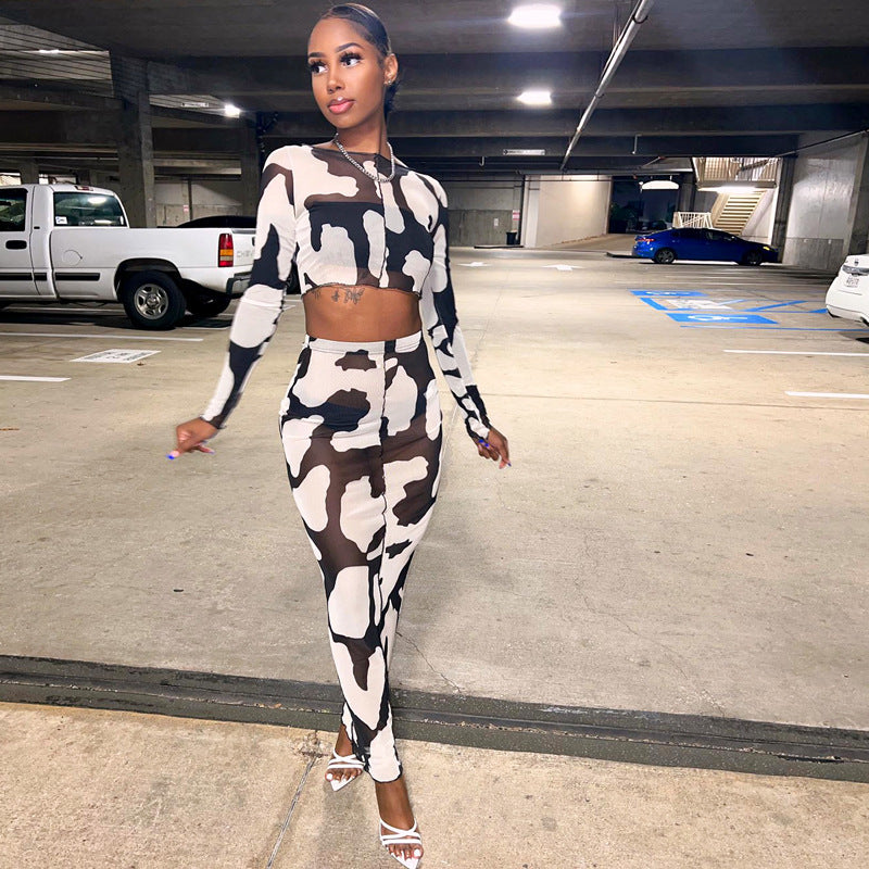 a woman in a cow print outfit