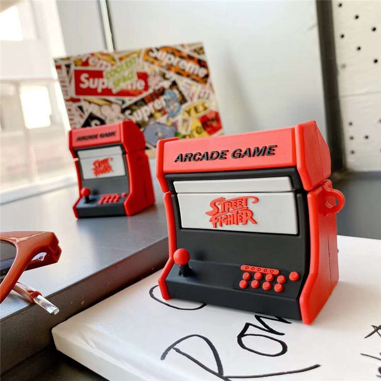 a pair of small arcade machines on a table