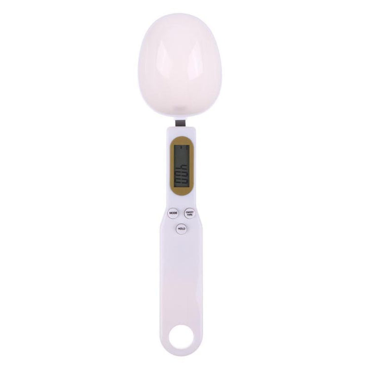 a white measuring spoon with a digital display