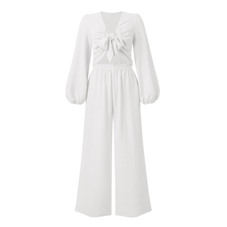a white dress with a bow