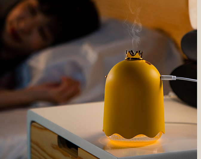 a yellow object with a white cord on top of it