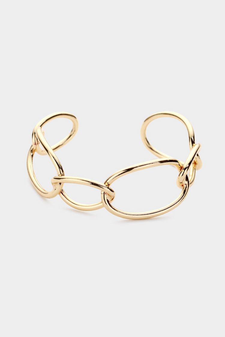 a gold bracelet with a knot