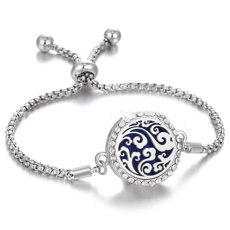 a silver bracelet with a blue and white design