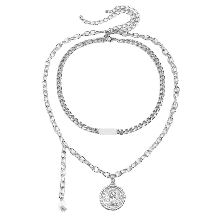 a necklace with a coin pendant