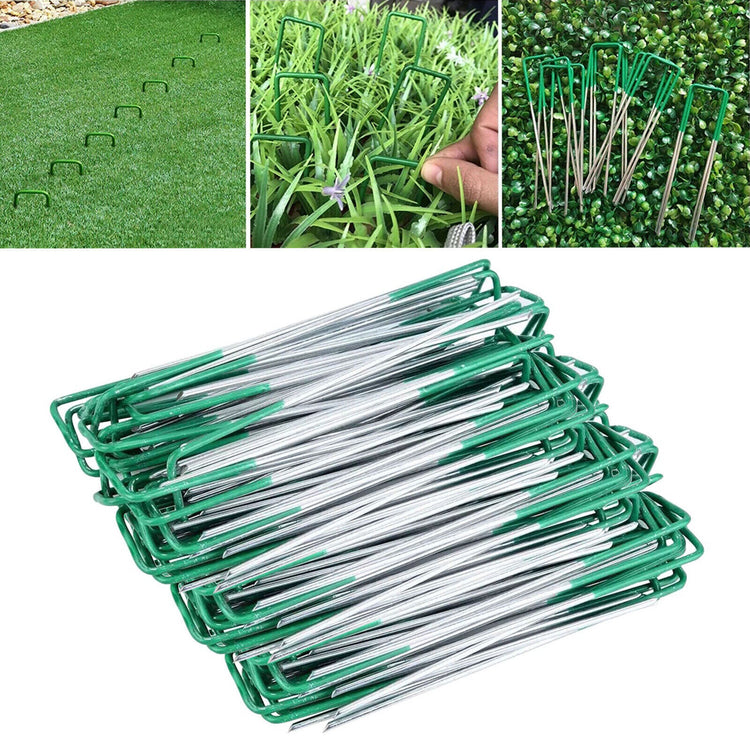 a group of green and white paper clips