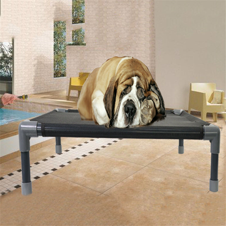 a dog lying on a small dog bed