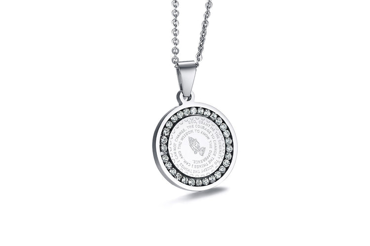 a silver medallion with diamonds on a chain