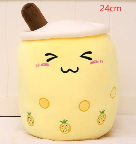 a yellow plushie with a face
