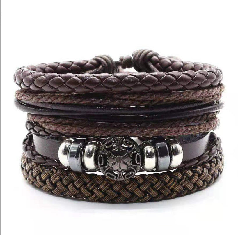 a stack of brown leather bracelets