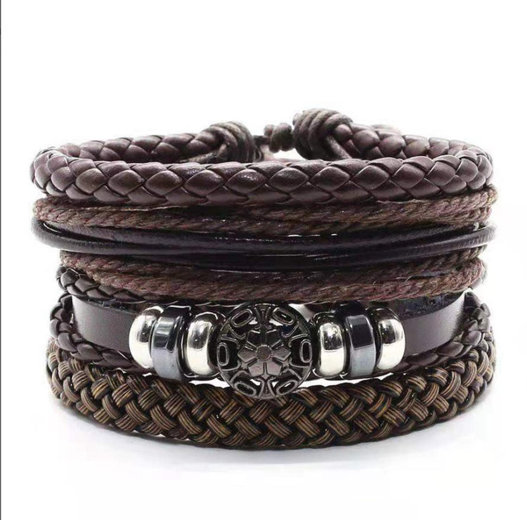 a stack of brown leather bracelets