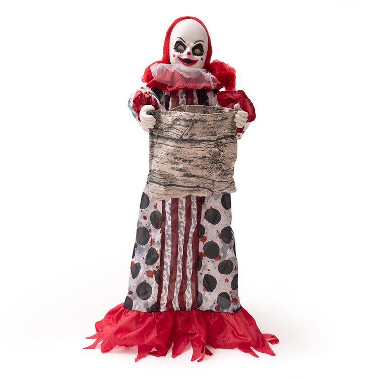 a clown doll holding a bag