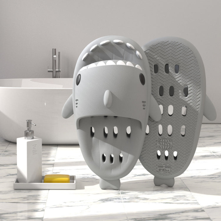 a shark shaped object next to a bathtub