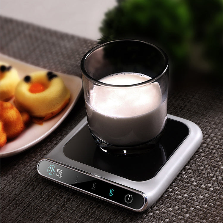 a glass of milk on a small electronic device