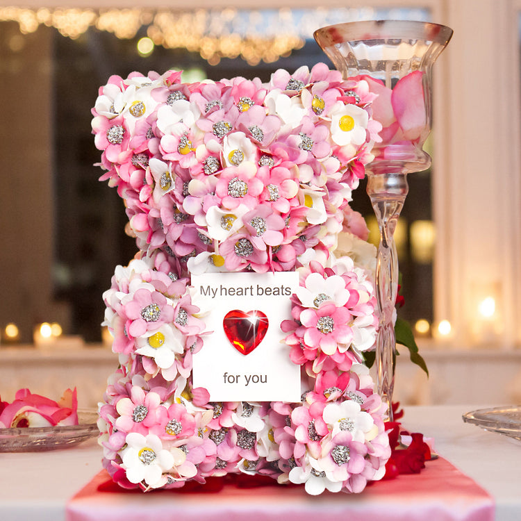 a pink and white flower arrangement