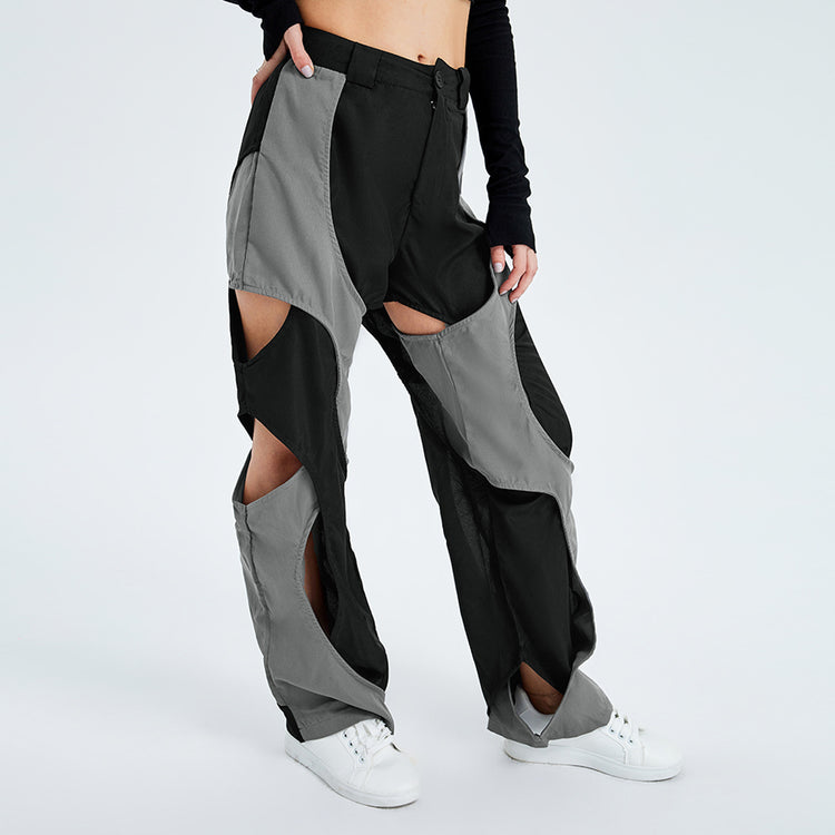 a person wearing a pair of pants with cut out pants
