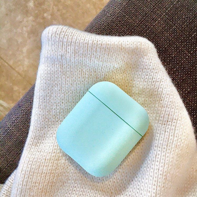 a blue square on a white knitted sweater