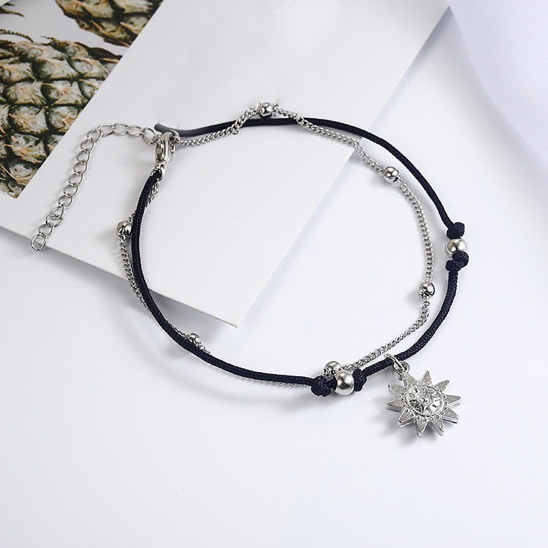 a silver and black bracelet