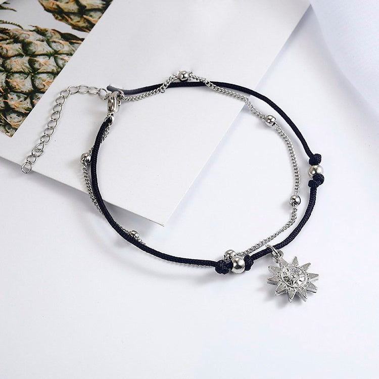 a silver and black bracelet