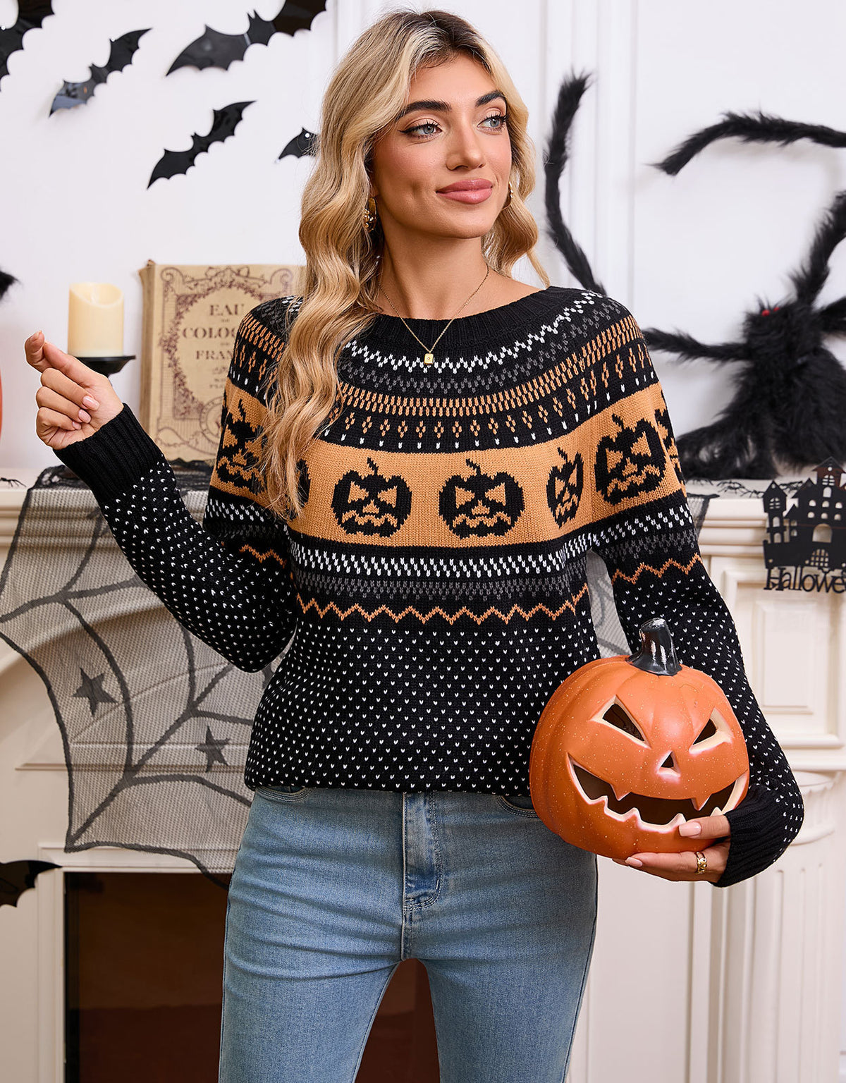 a woman holding a pumpkin and a candle