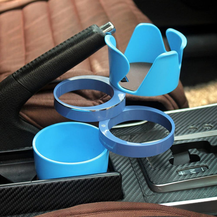 a blue plastic cup holder in a car