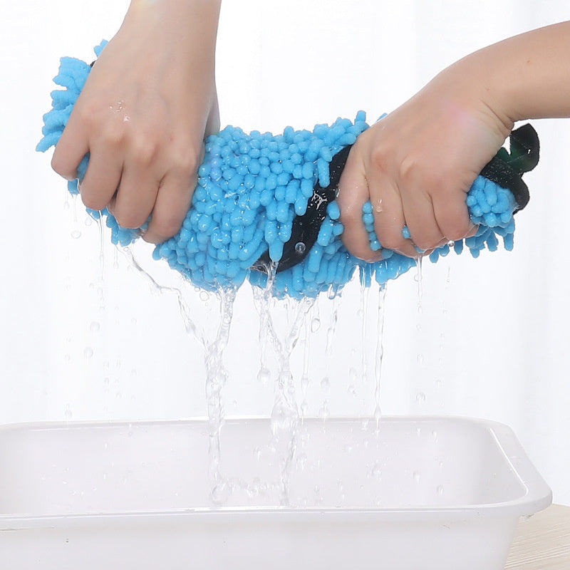 a person holding a blue sponge