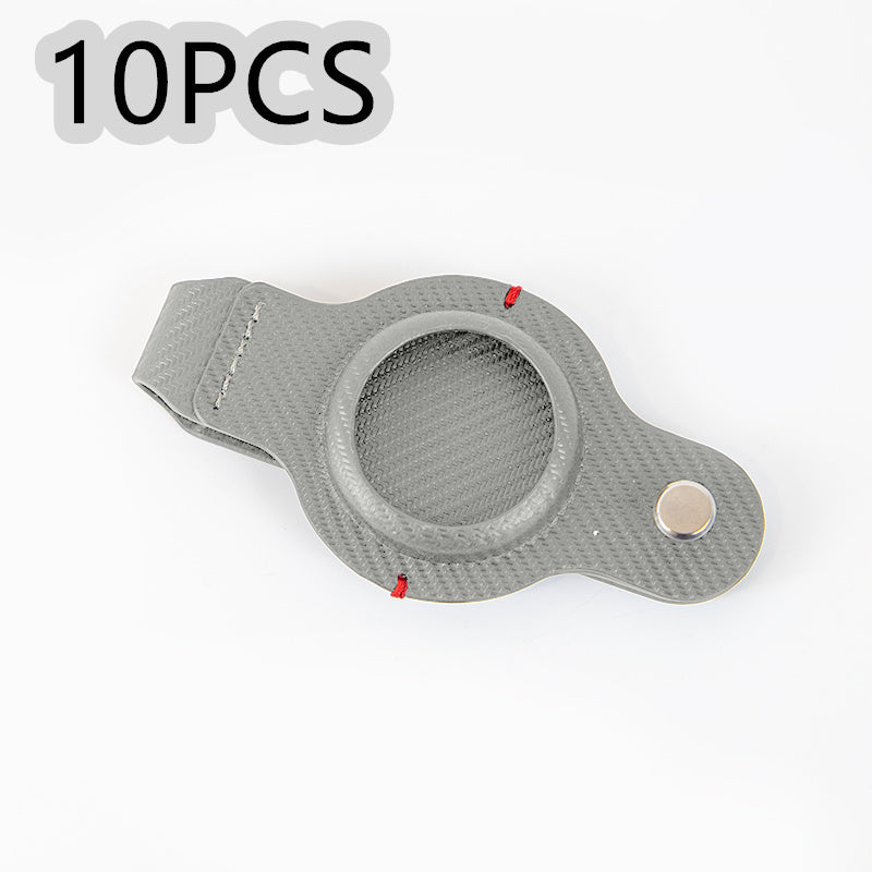a grey plastic case with a button