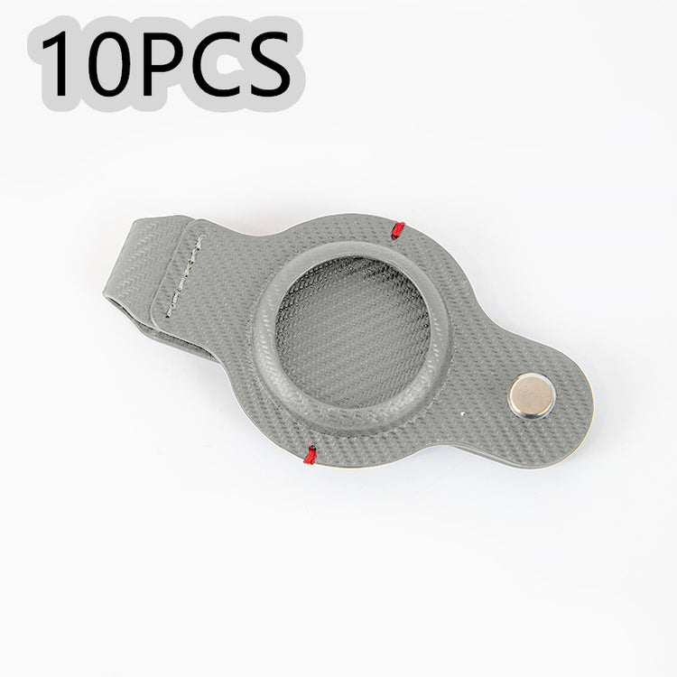 a grey plastic case with a button