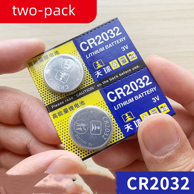 a person holding two batteries