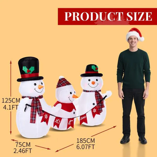 a man standing next to a group of snowmen