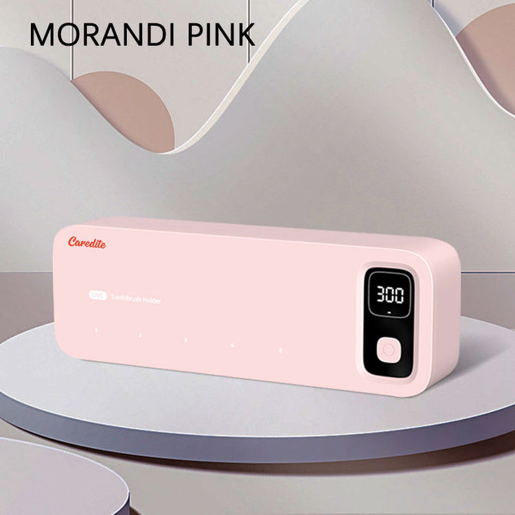 a pink rectangular device on a round platform
