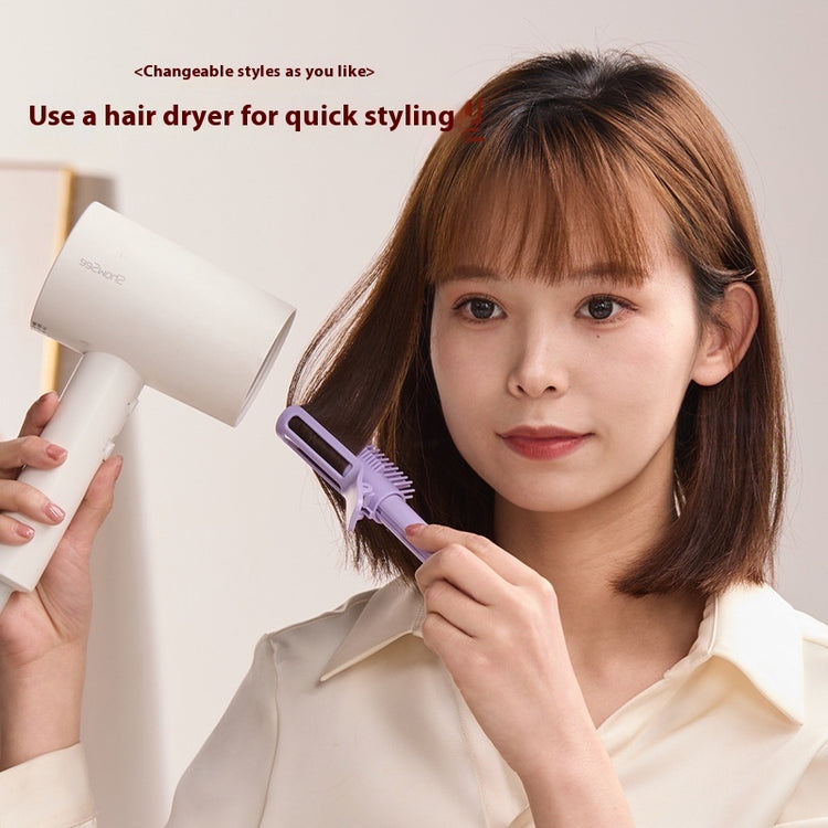 a woman holding a hair dryer