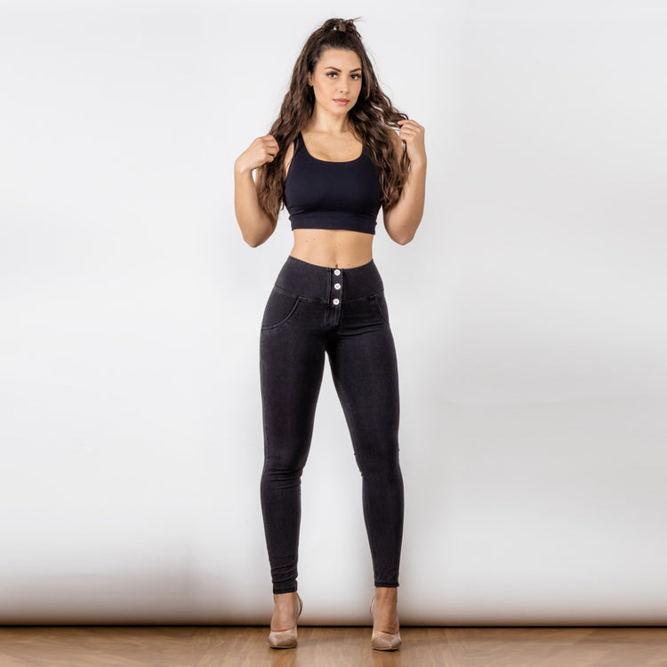 a woman in black top and black jeans