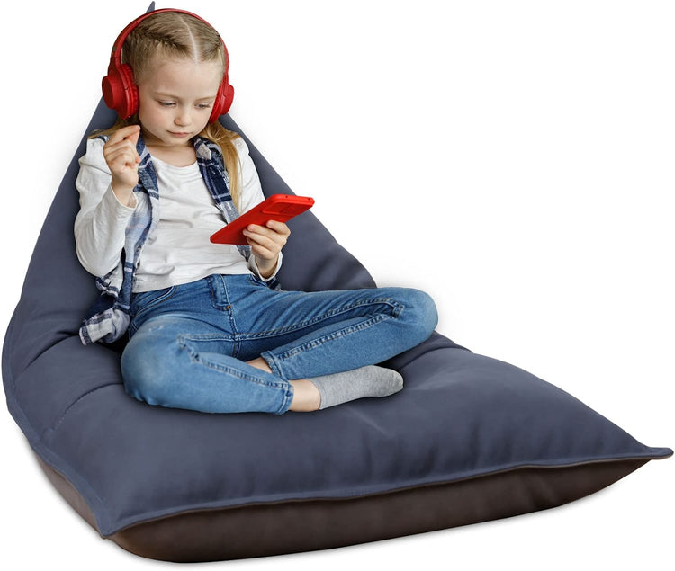 a girl sitting on a bean bag
