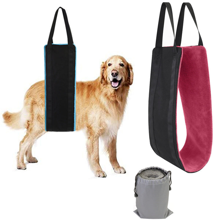 a dog standing next to a bag