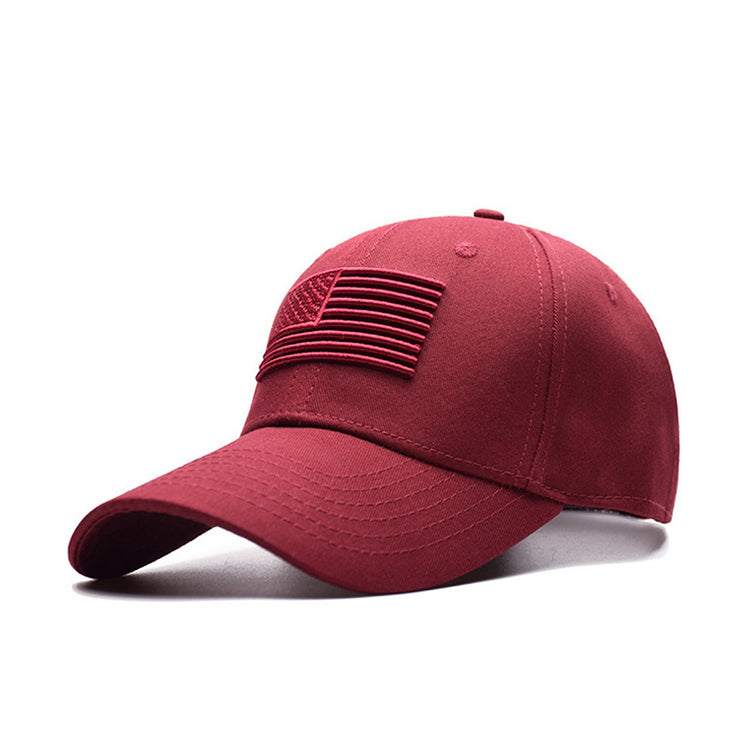 a red hat with a flag patch on it
