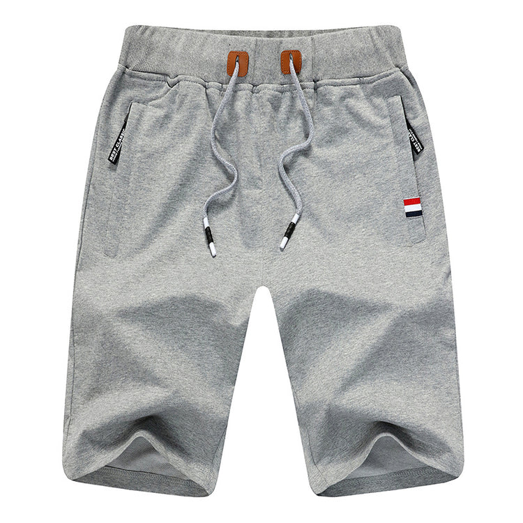a grey shorts with a brown belt